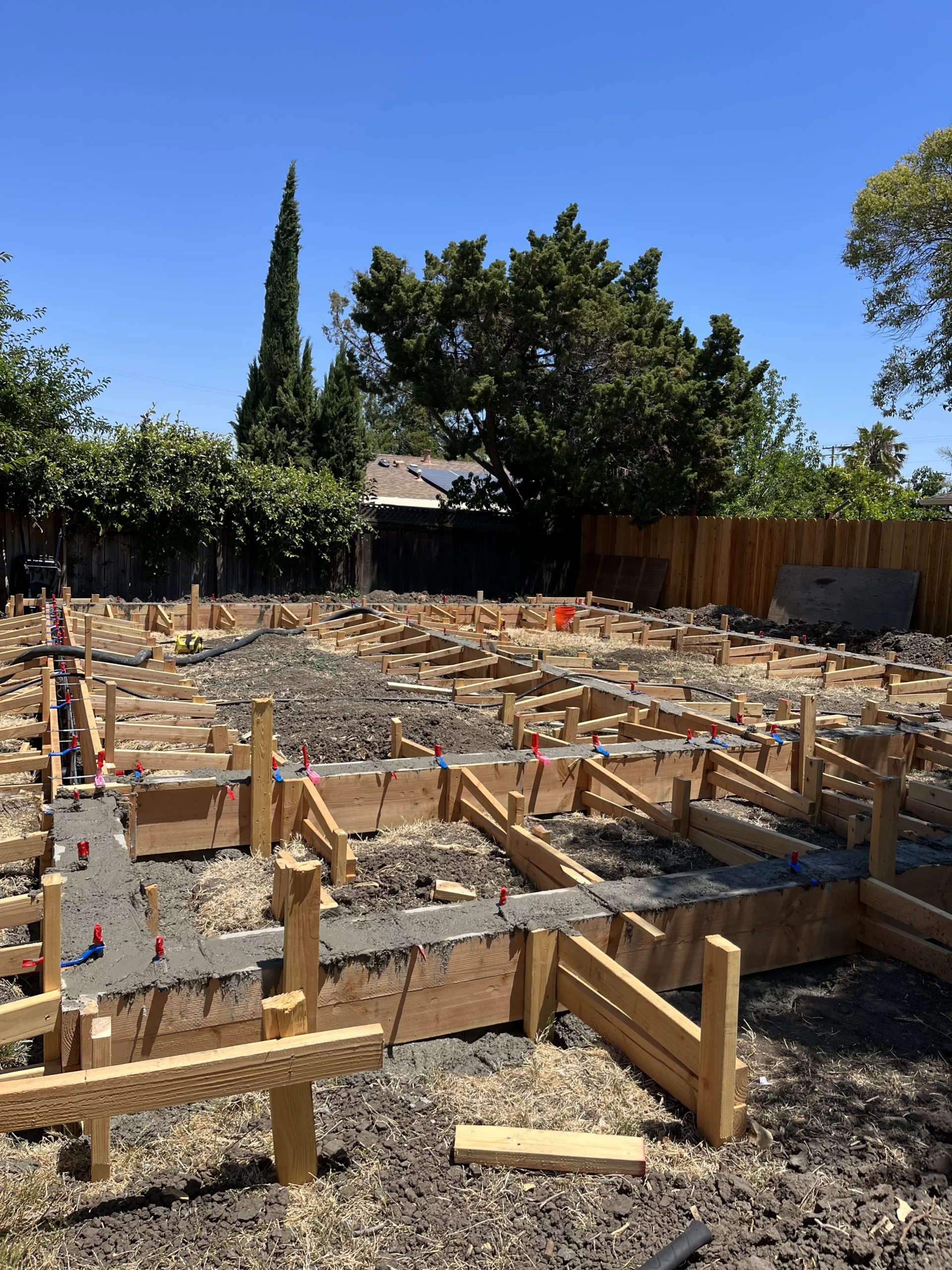 A house is being built on a concrete slab.