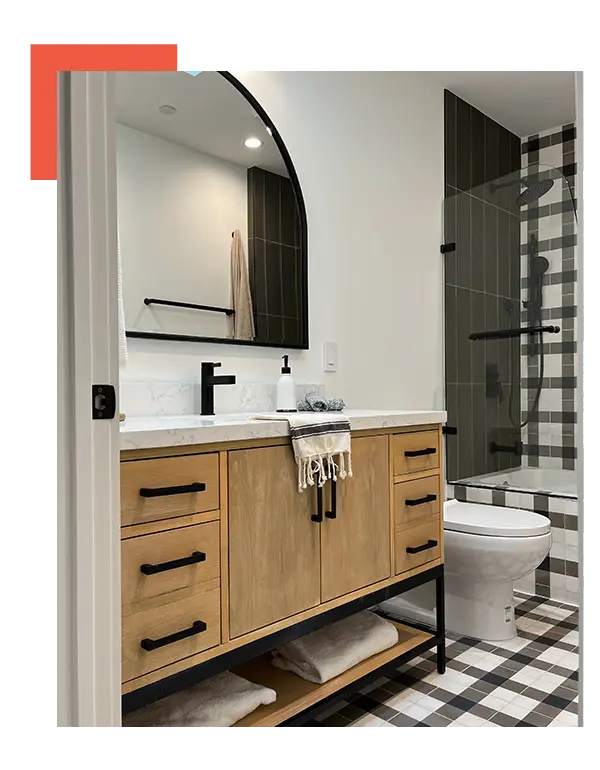 A bathroom with a black and white checkered floor.