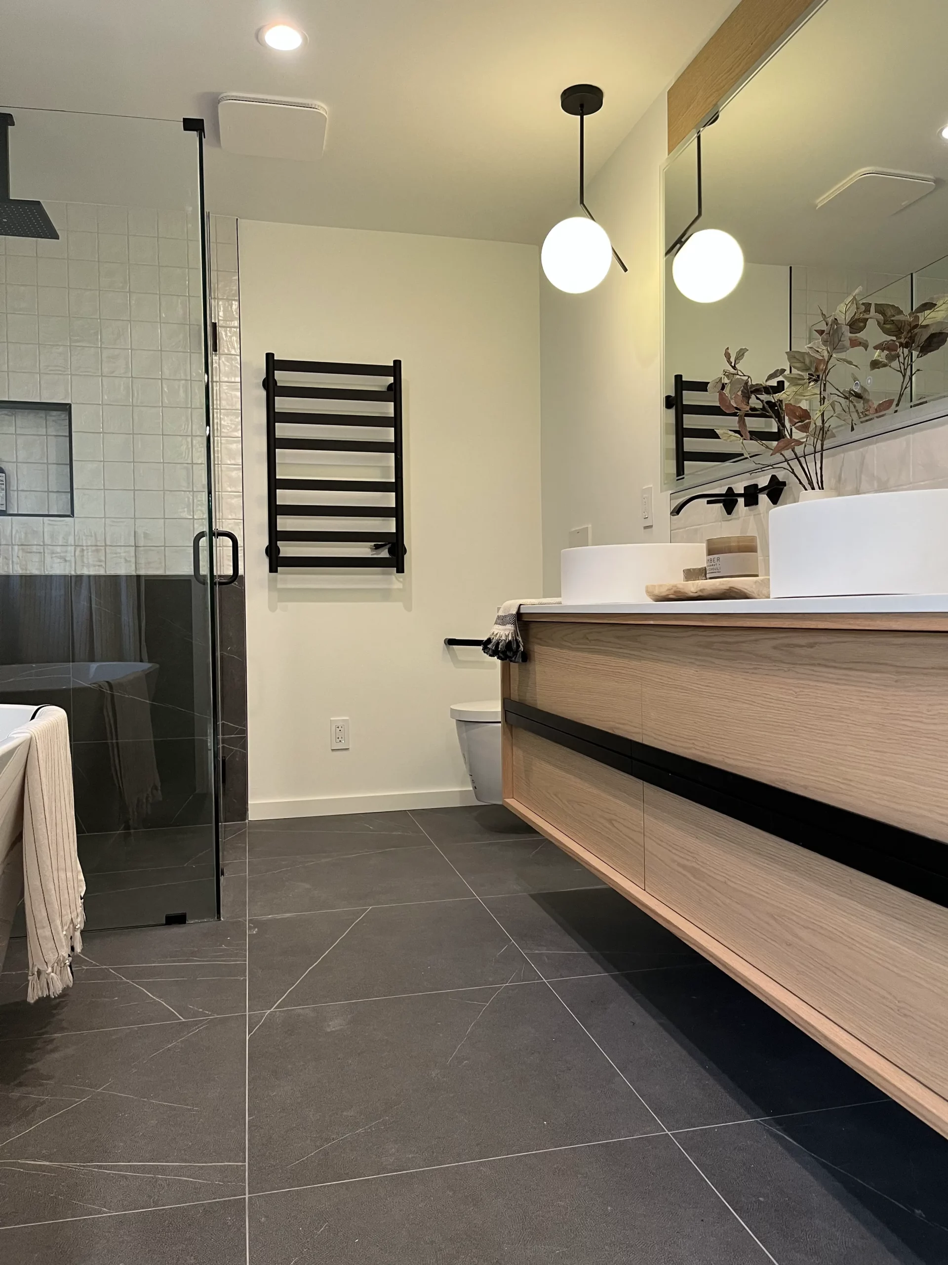 A modern bathroom with a bathtub and sink.