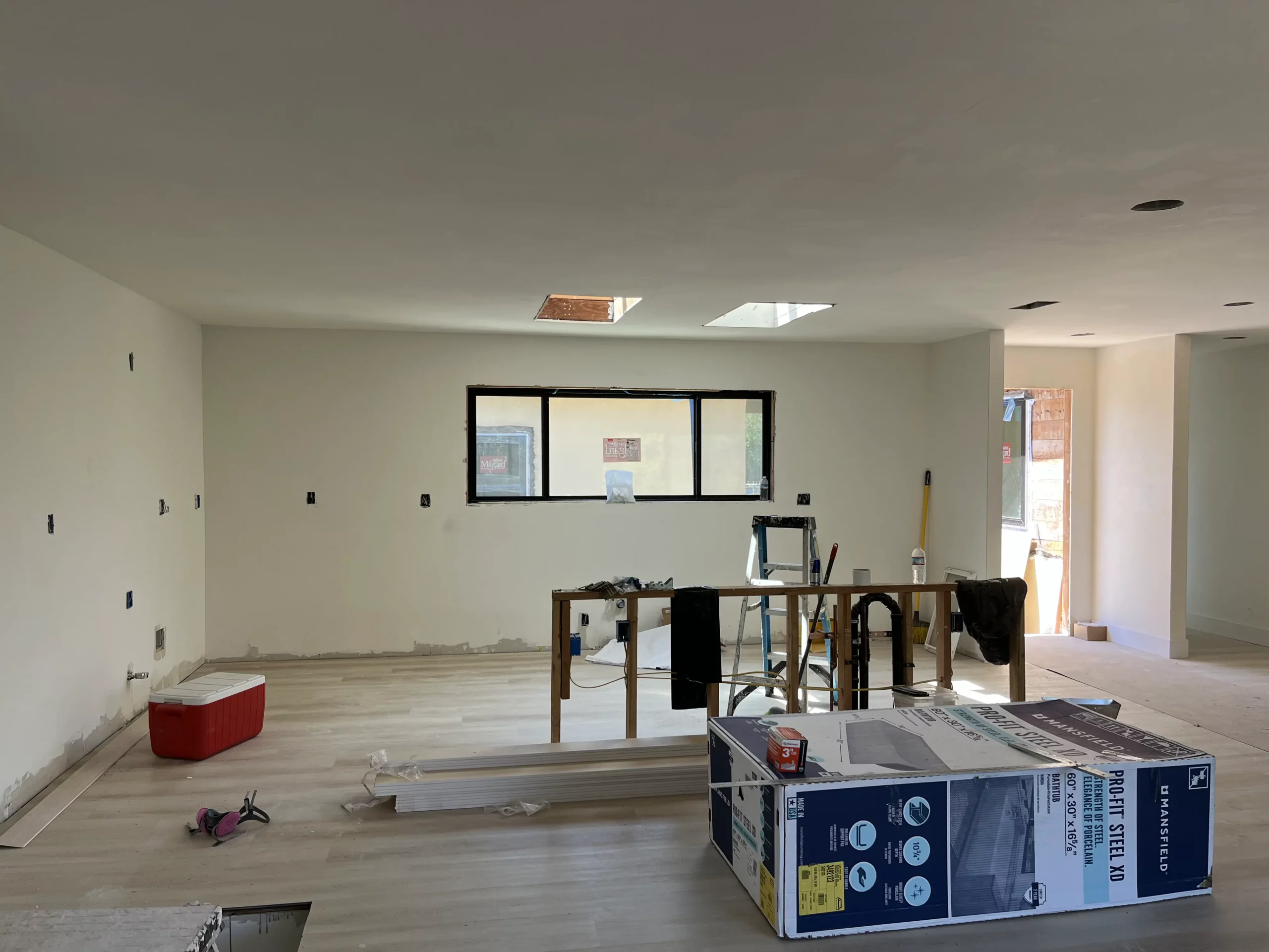 An empty living room is being remodeled.