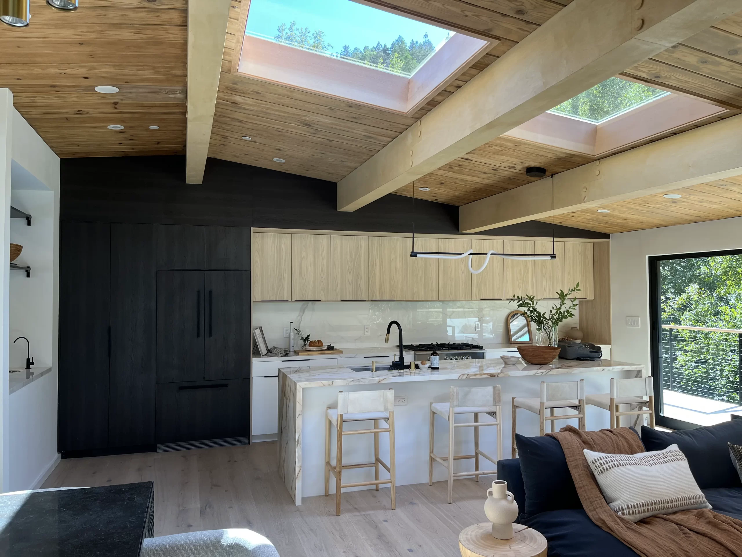 General construction contractor, a modern kitchen with a skylight above it.