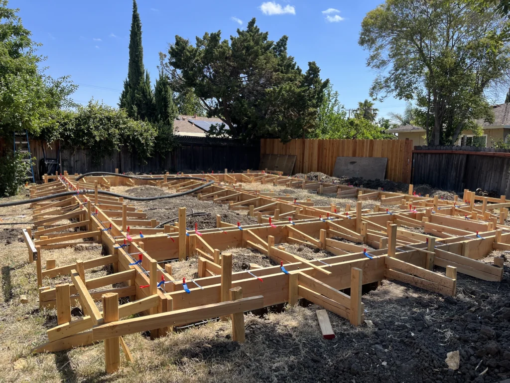 A house is being built with wooden framing.